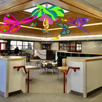 Colorful suspended kinetic artwork in a lobby